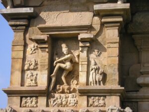 The sculpture of Nataraj is also visible on the temple wall.